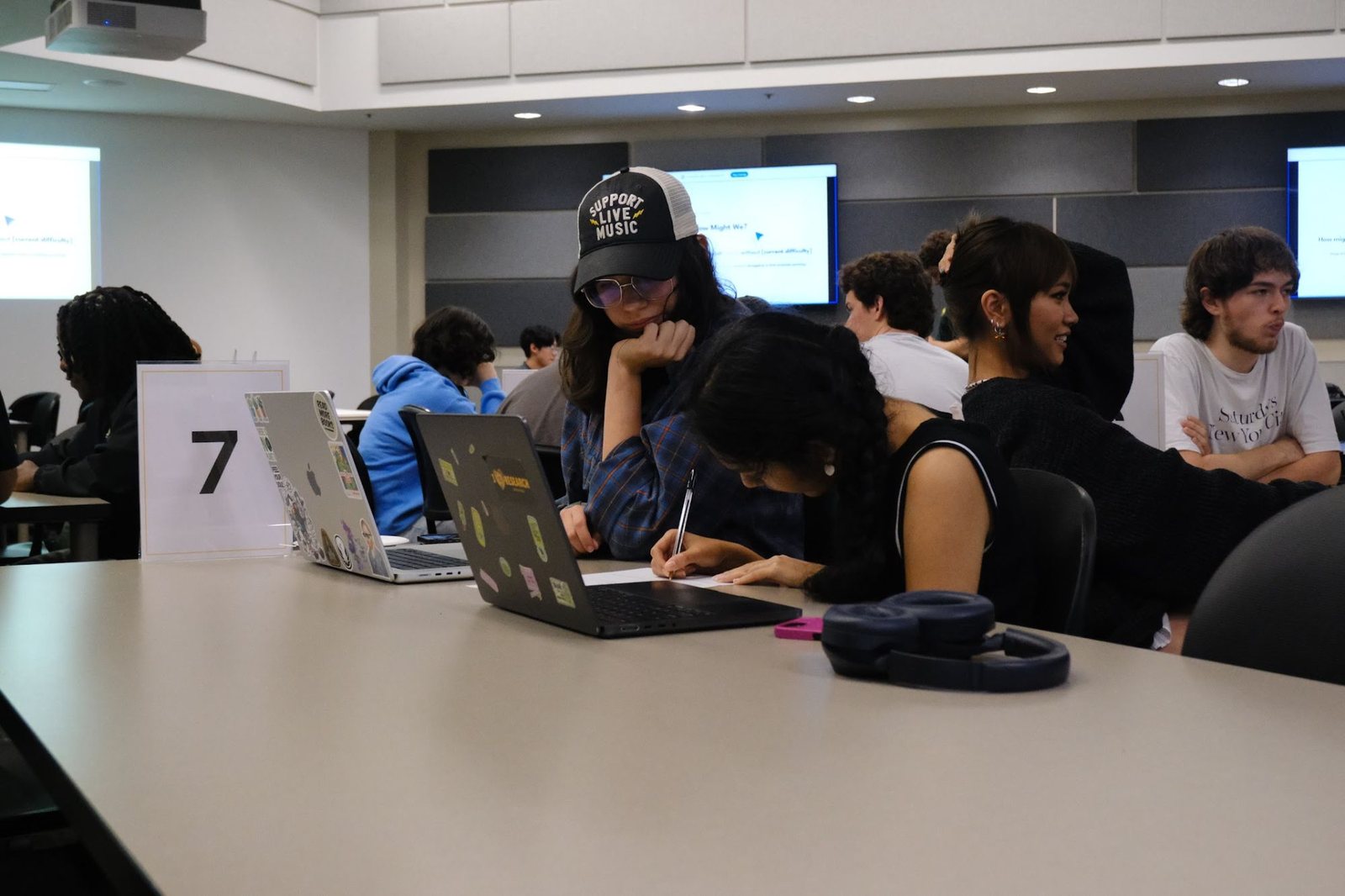 Students sketching at table seven